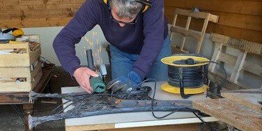 Preparing the bench ends for sandblasting and painting