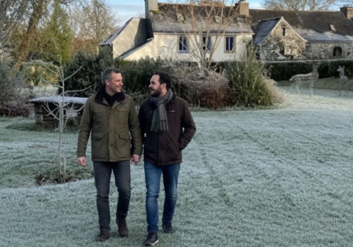 Couple enjoying a peaceful winter walk through the gardens at Kergudon holiday cottages in Finistère, Brittany.