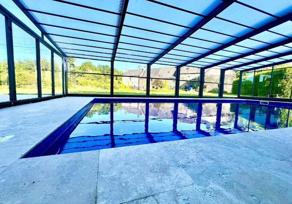 Heated swimming pool with telescopic enclosure at Kergudon Brittany